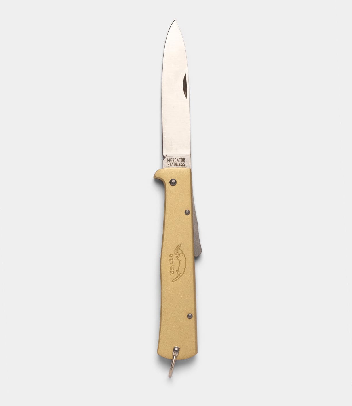 A Brass Mercator folding pocket knife by Best Made Co, with a metallic blade and beige handle engraved with an animal logo and "OTTER," is displayed on a plain light gray background, evoking classic craftsmanship.