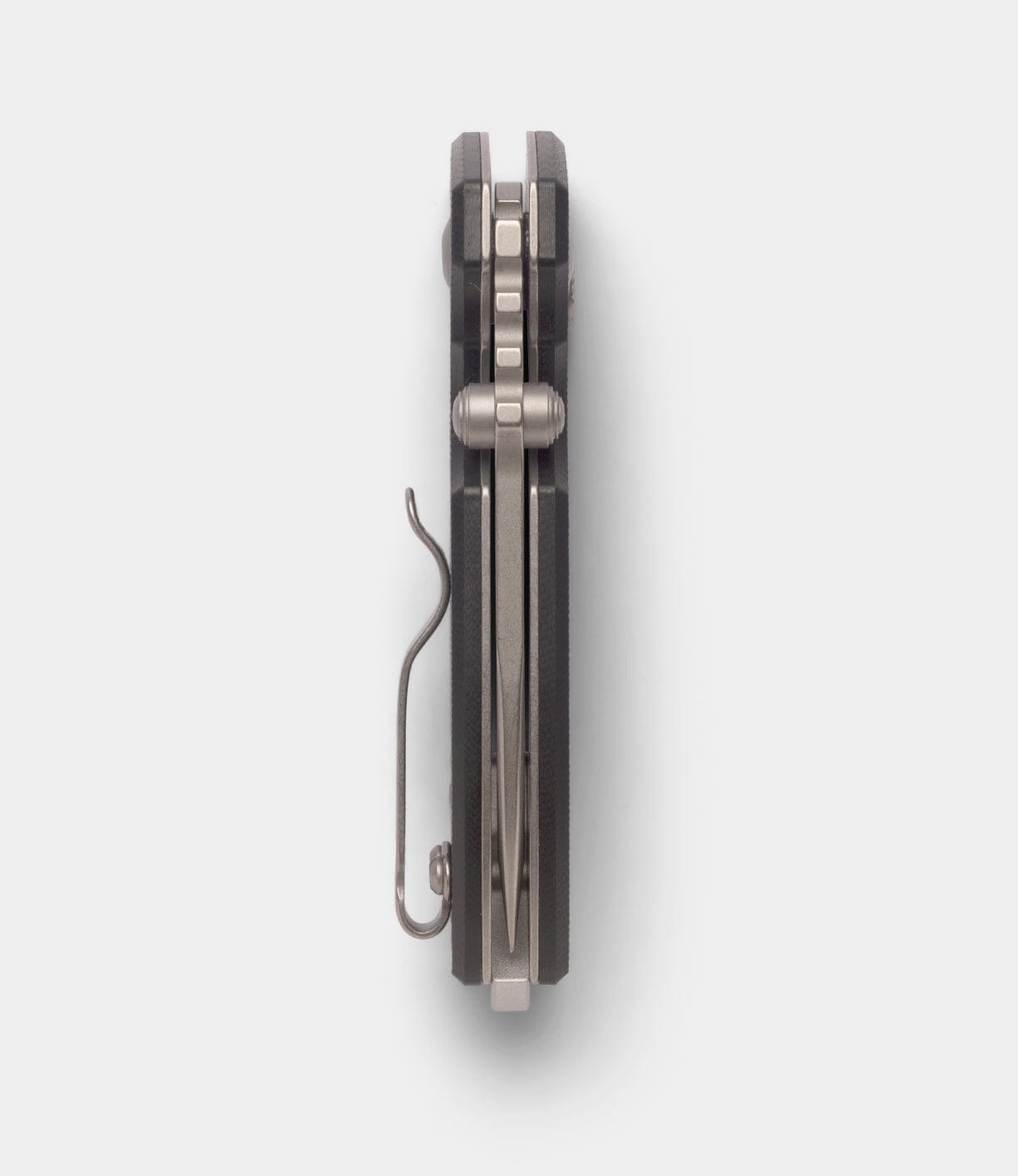 Top-down view of a closed Best Made Co CRKT Squid knife with D2 steel blade and metal clip, highlighting the spine and hinge mechanism on a plain white background.
