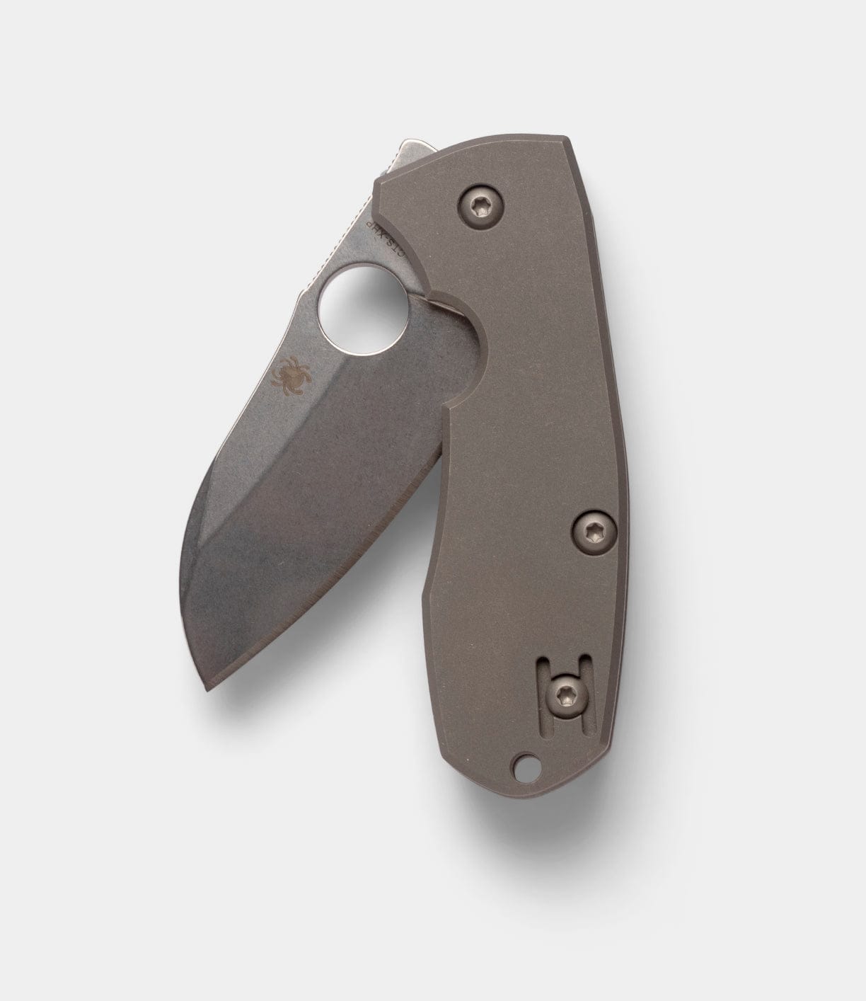 The Best Made Co Spyderco Techno 2 is a folding pocket knife with a partially open, stonewashed CTS-XHP steel blade featuring a thumb hole and a gray titanium framelock handle, shown on a plain white background.