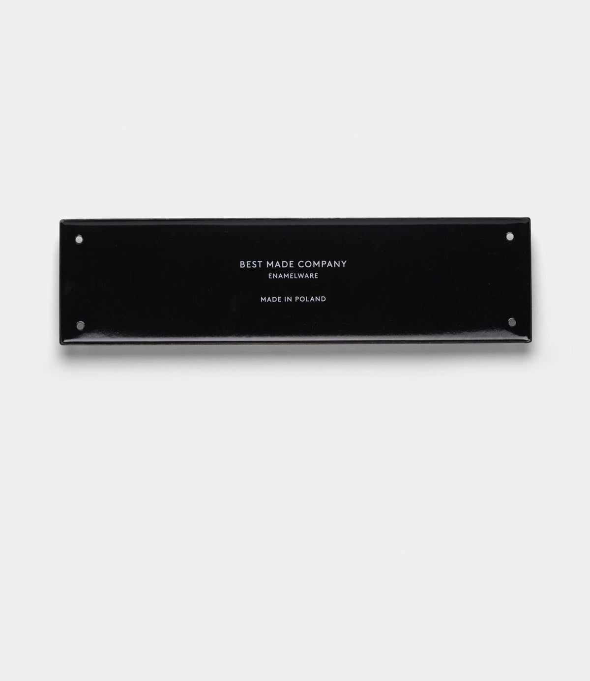 A handcrafted rectangular black enamel sign by Best Made Co., featuring white text that reads “Stay Sharp” (Kanji Edition), with four small corner holes, centered on a plain light gray background.