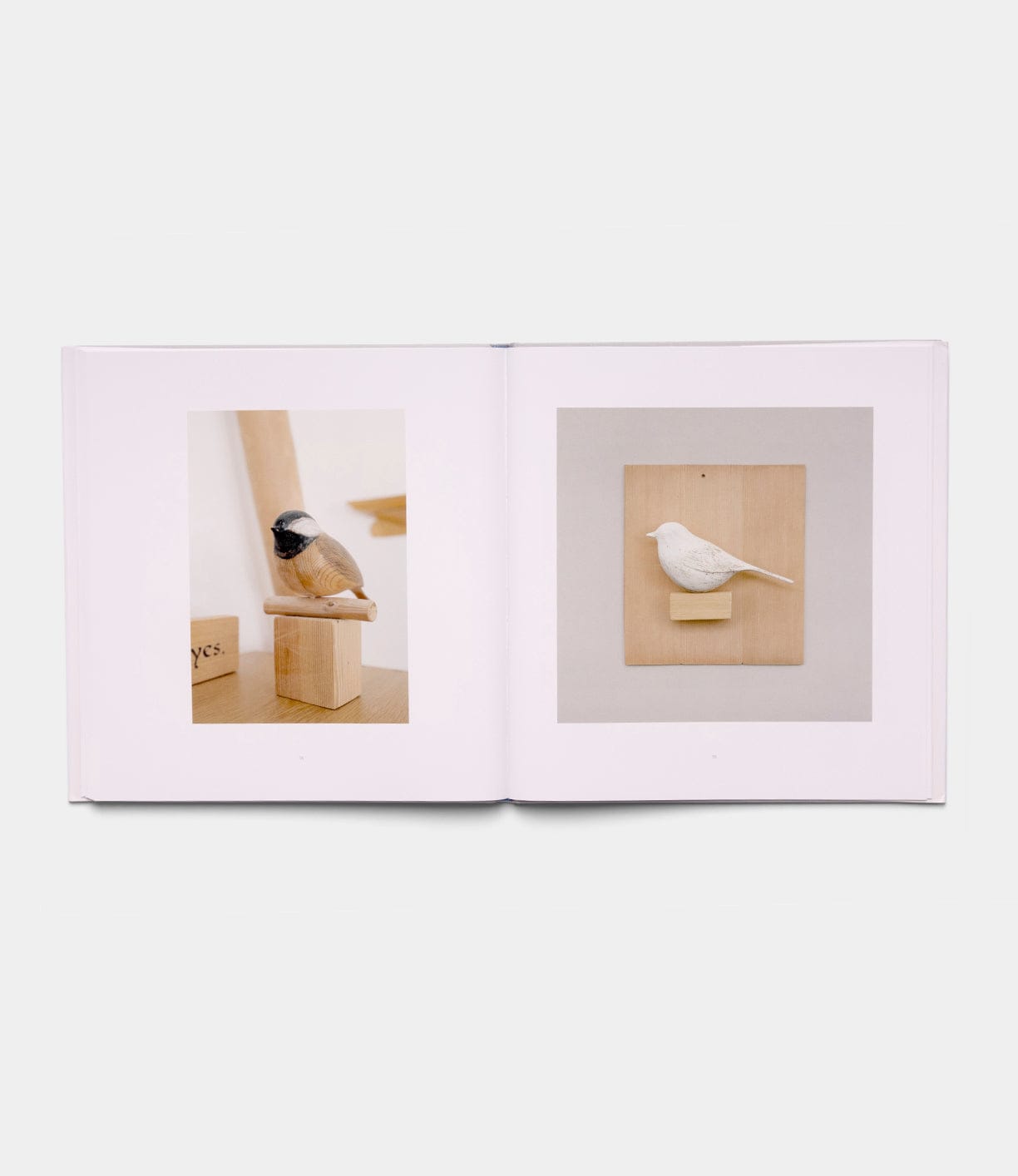 An open spread of "Boats, Books, Birds" by Best Made Co. shows a painted wooden bird on the left page and a plain white carved bird mounted on wood on the right.