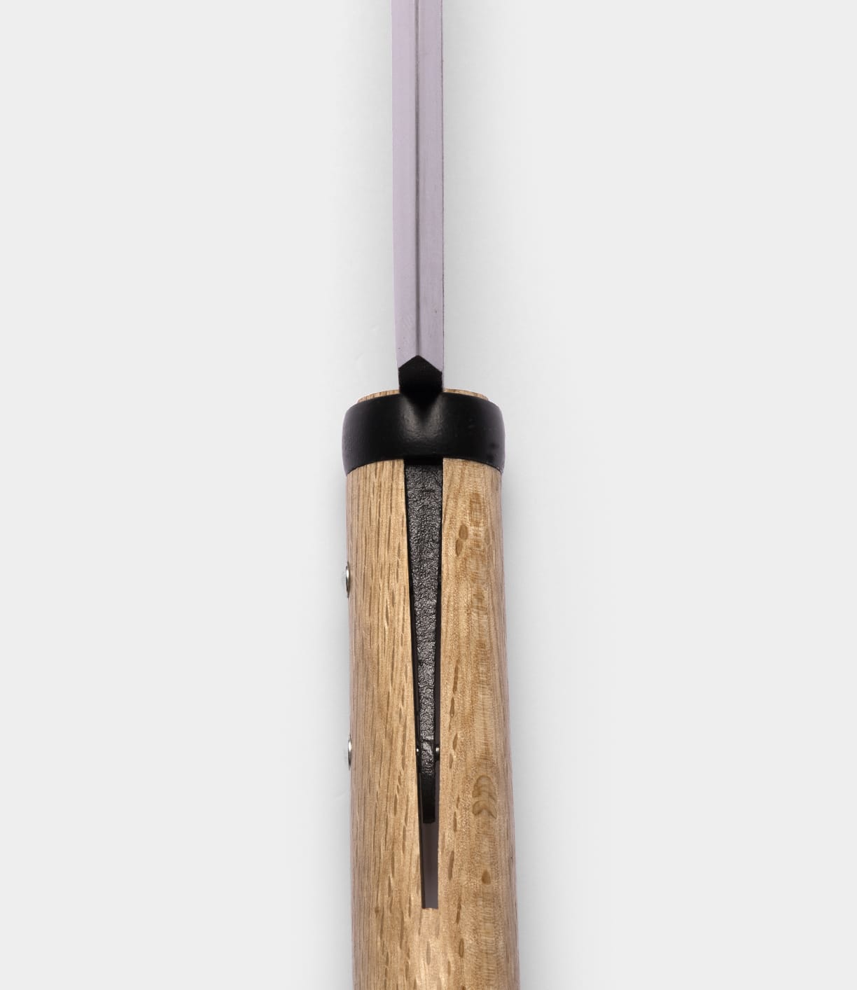 Close-up view of the Azuma Hatchet by Best Made Co., featuring a wooden handle and a carbon steel blade, positioned vertically against a plain white background—showcasing the refined Japanese craftsmanship of this exceptional tool.