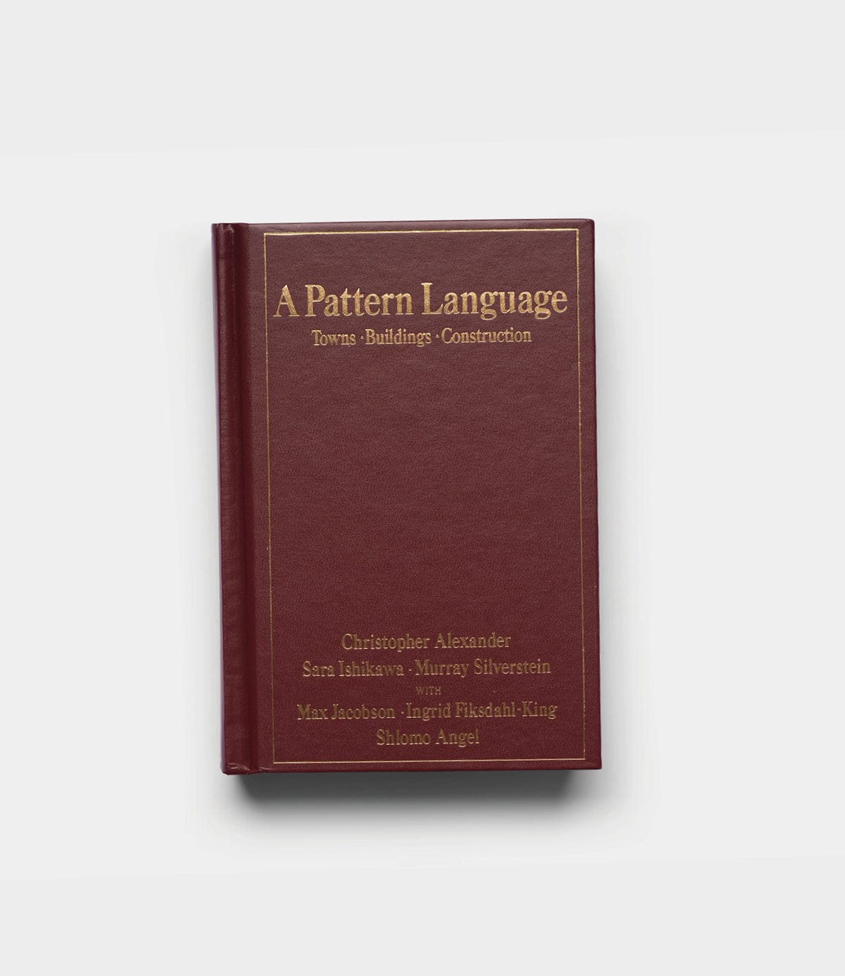 A hardcover copy of "A Pattern Language" by Best Made Co., featuring a maroon cover with gold text, is shown against a plain white background.