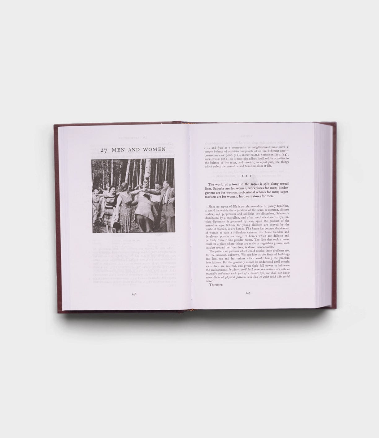An open copy of "A Pattern Language" by Best Made Co., opened to chapter 27 titled "Men and Women," features a black-and-white photo of people walking in a wooded area on the left page, with text on both pages, all set against a plain white background.