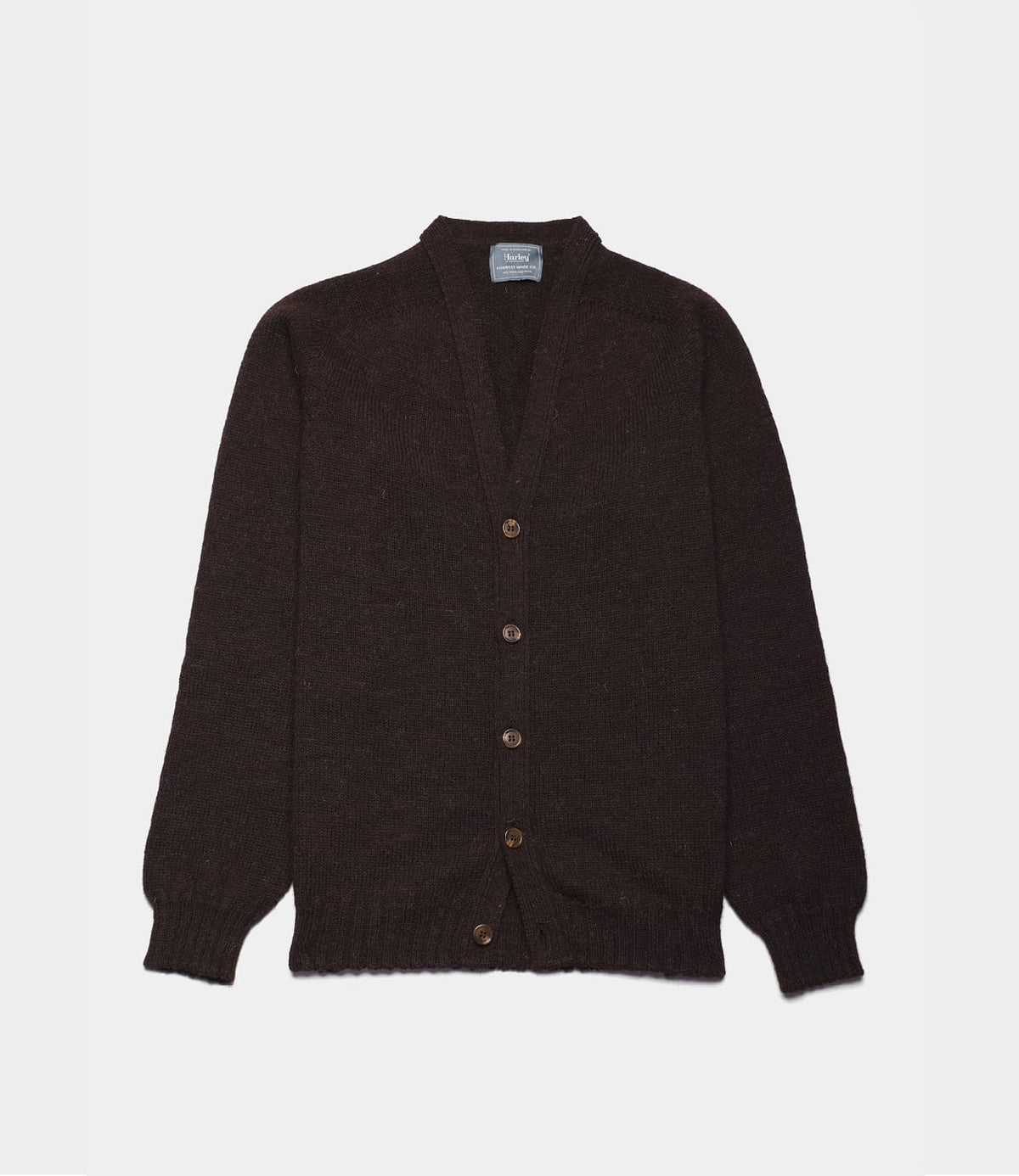 Best Made Co. Black Sheep Cardigan: a dark brown long-sleeved V-neck cardigan made of undyed Shetland wool, featuring five buttons down the front.