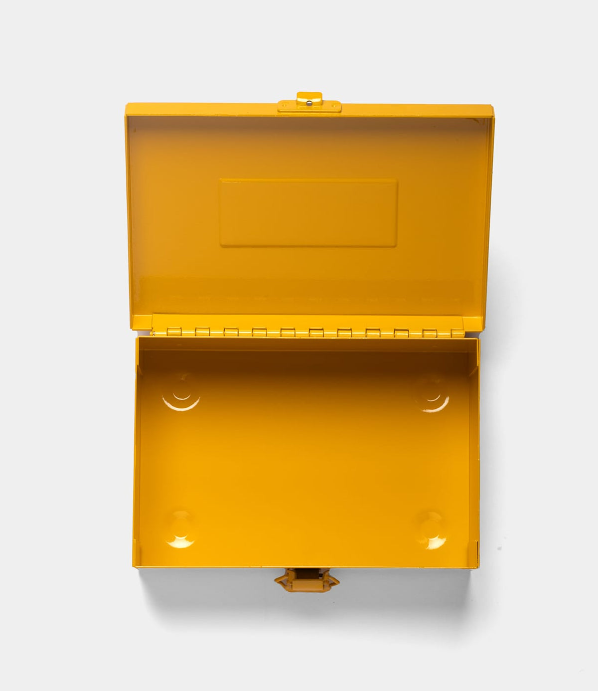 The Best Made Co. Type 6 Strongbox Yellow, seen from above with its open hinged lid, reveals a durable steel, empty interior against a plain white background.