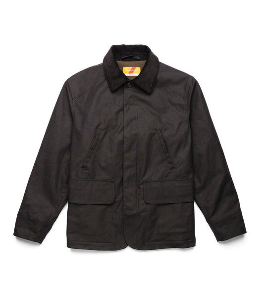 The Best Made Co. Wool-Lined Waxed Field Jacket Black, shown partially open on a white background, features a corduroy collar, Wyoming wool lining, interior label, and a green inner pocket with a patch and blue tag.