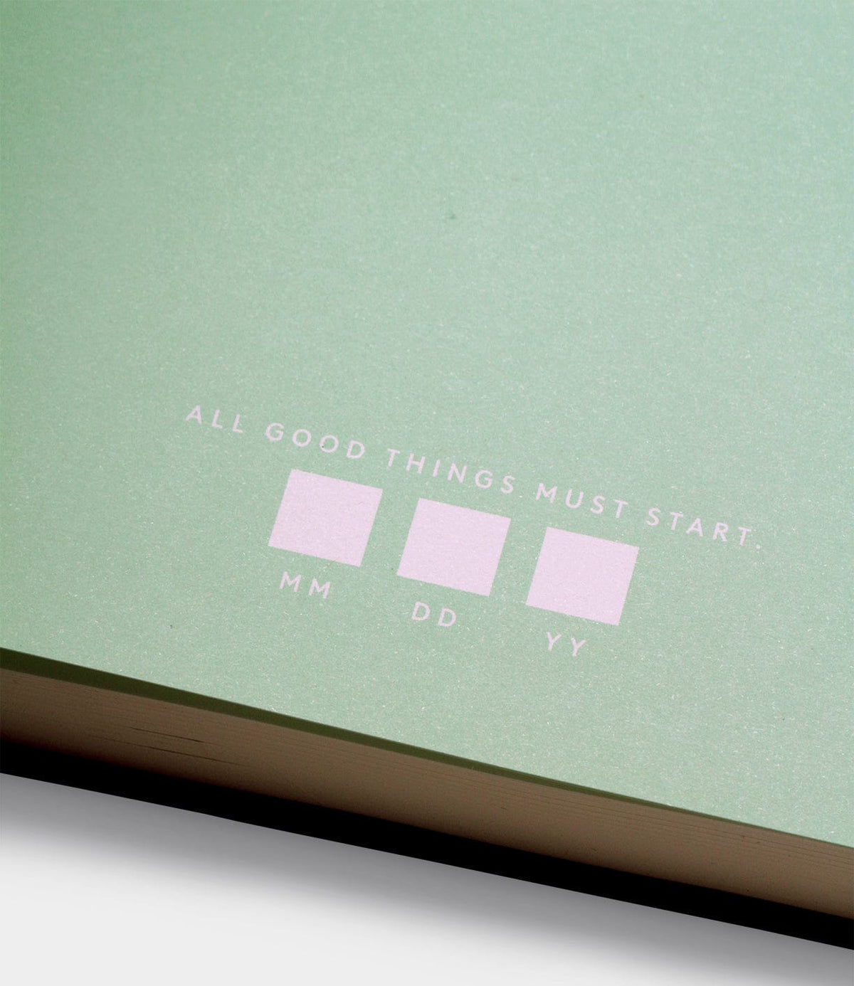 A close-up of the Best Made Co. S.B.T. Max Cloth-Bound Notebook shows a green cover with "ALL GOOD THINGS MUST START:" and three blank boxes labeled MM, DD, YY for entering a date.