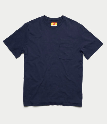 The Best Made Co. Standard Pocket T-Shirt Navy is a garment-dyed, short-sleeve tee made from soft Peruvian tangüis cotton, featuring a left chest pocket—an everyday essential shown flat on a light background.
