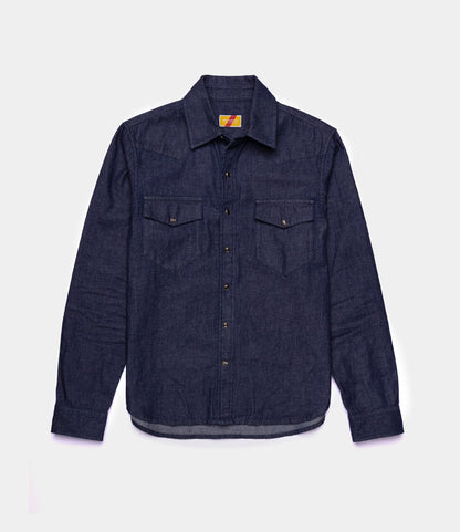 The Best Made Co. Fukuyama Snap-Front Shirt, a long-sleeve Japanese indigo denim shirt with two chest pockets and a collar, is laid flat on a plain white background.