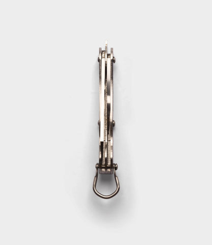 A Best Made Co. British Army Knife is shown from above with its metal frame, hinge, and closed blade visible against a plain light gray background.