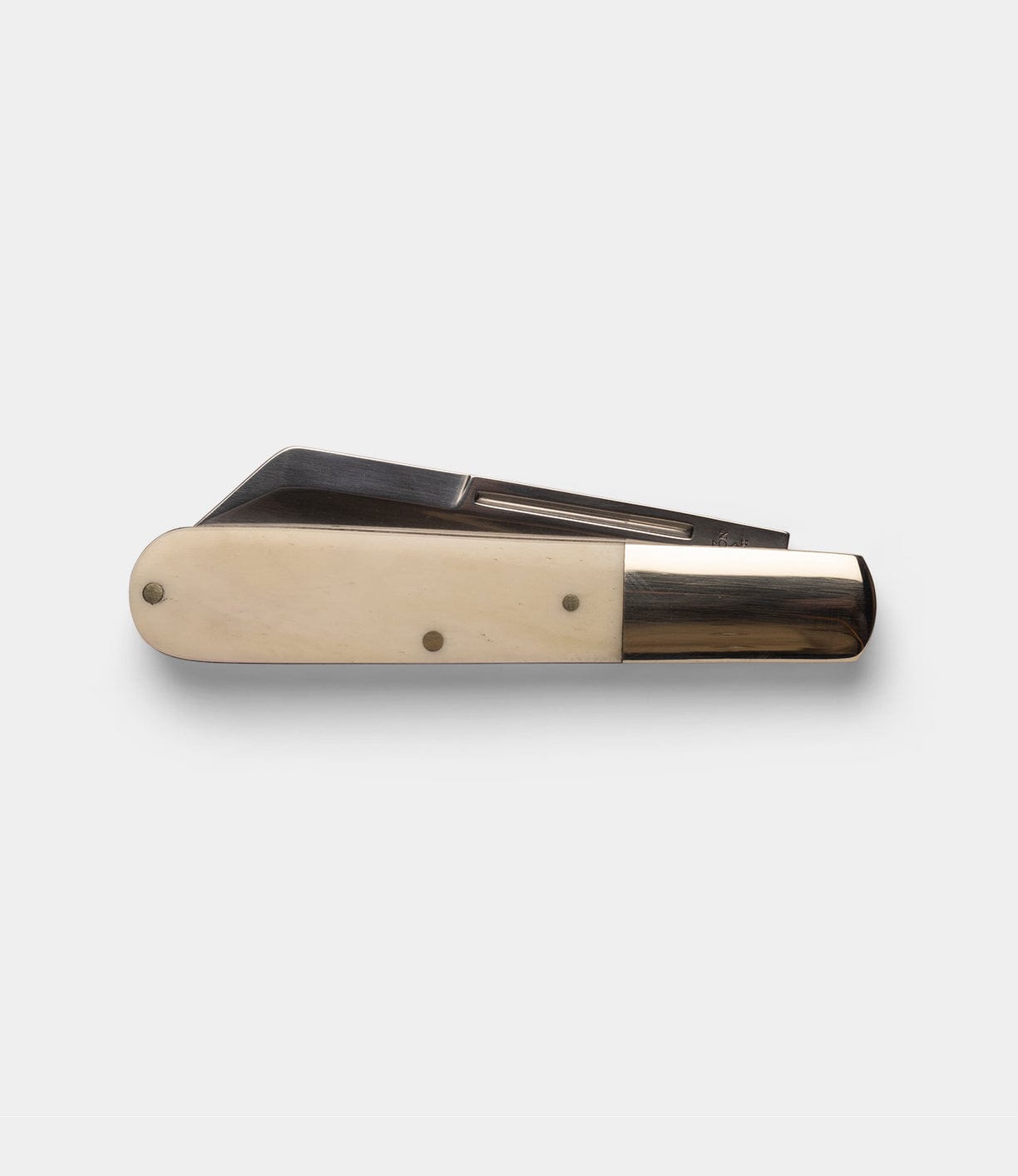 A closed Best Made Co Barlow Knife with a cream-colored bone handle and metallic ends is displayed on a plain light gray background.