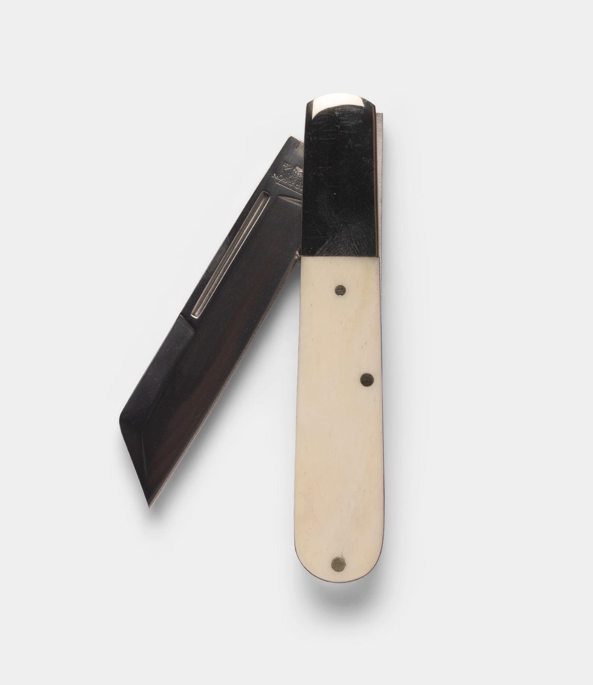 The Best Made Co Barlow Knife features a folding design with a white bone handle and a partially open, dark stainless steel blade, shown against a plain white background.