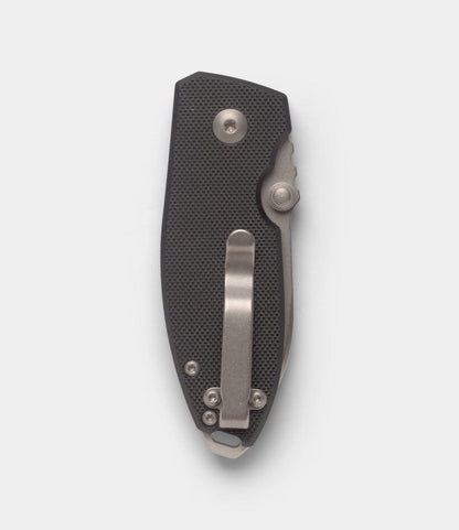 A closed Best Made Co. CRKT Squid pocket knife with a textured black handle, D2 steel blade, and silver metal pocket clip is displayed against a plain light background.