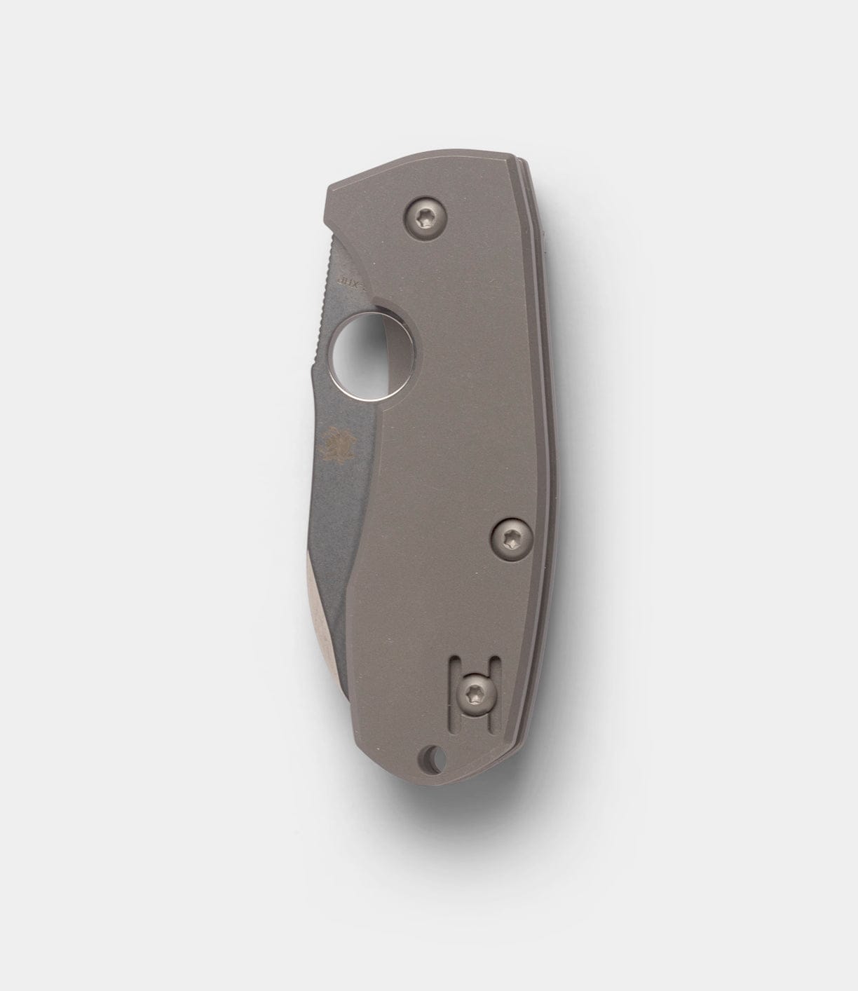 The Spyderco Techno 2 folding pocket knife by Best Made Co, with a titanium framelock and matte gray handle, is shown closed with its partially visible blade on a plain white background.