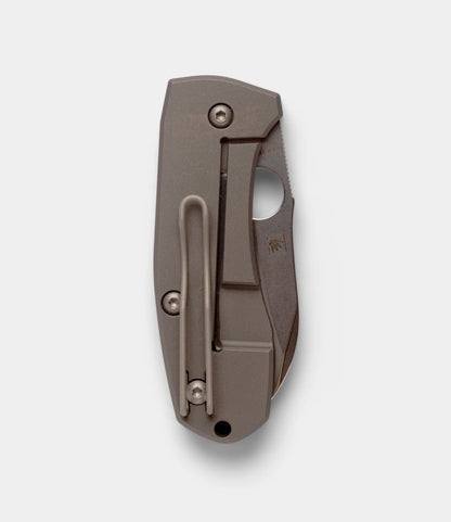 The Best Made Co. Spyderco Techno 2 is a closed folding pocket knife with a titanium framelock handle, pocket clip, and partially visible CTS-XHP steel blade, shown against a plain white background.