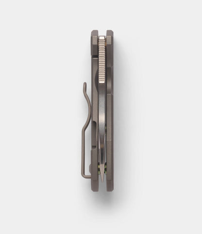 A top-down view of the Best Made Co. Spyderco Techno 2 folding pocket knife, featuring a titanium framelock, metal body with clip, and a CTS-XHP steel blade centered between the handle scales.