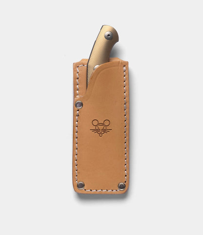 A handmade leather sheath with white stitching and an embossed mouse face logo holds the Best Made Co. GiantMouse GMF1-P (BMC Edition), its textured metallic handle partially visible.