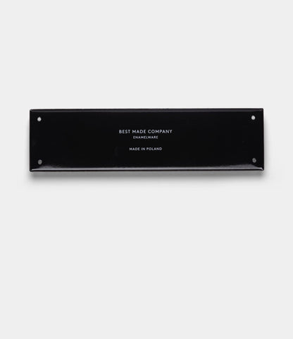 A handcrafted rectangular black enamel sign by Best Made Co., featuring white text that reads “Stay Sharp” (Kanji Edition), with four small corner holes, centered on a plain light gray background.