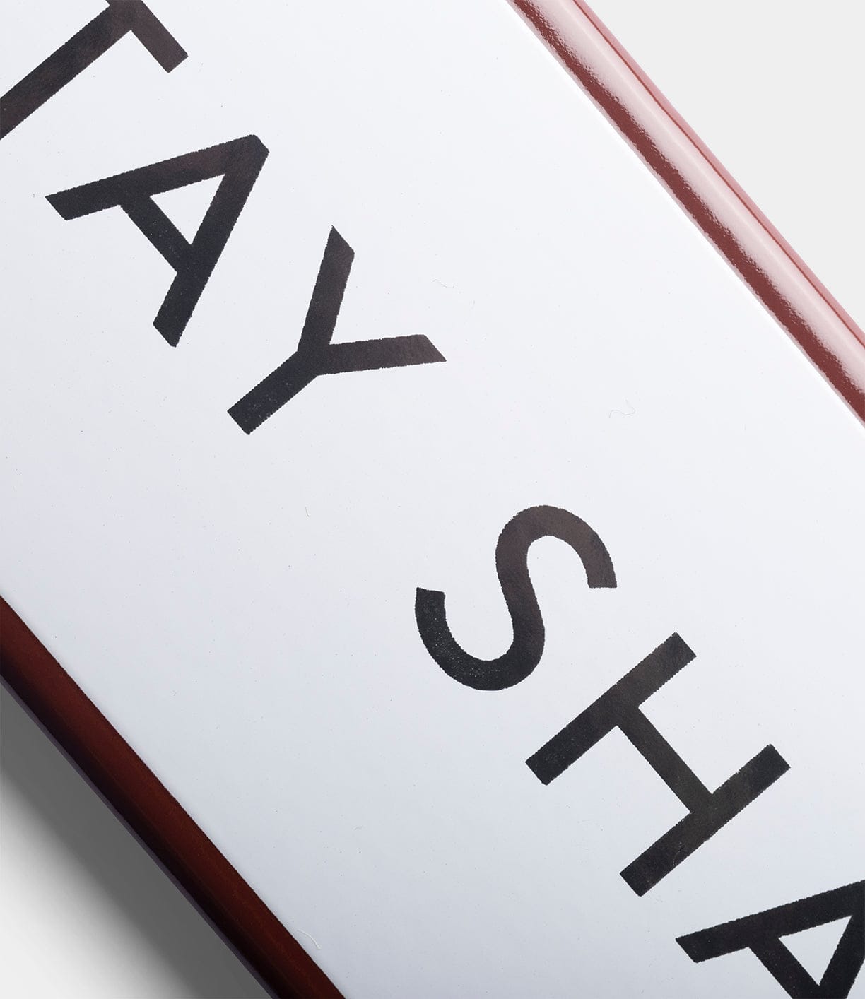 Close-up of the “Stay Sharp” enamel steel sign by Best Made Company Co., hand-crafted in Poland, featuring bold black letters on white with a dark red right border, shown against a light gray background.