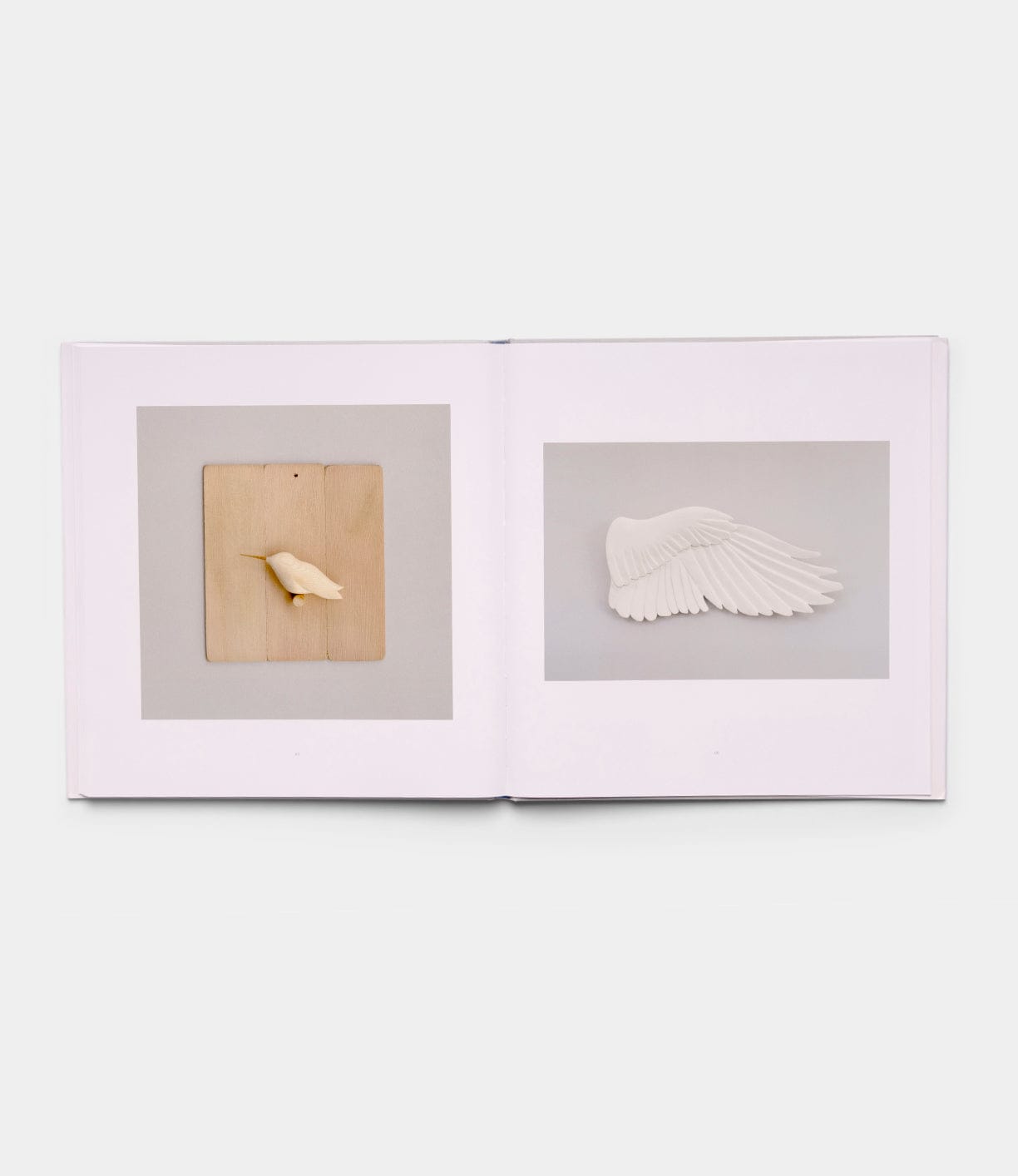 An open spread of "Boats, Books, Birds" by Best Made Co.: the left page displays a small bird sculpture on wood, while the right page shows a white bird wing sculpture against a gray background.