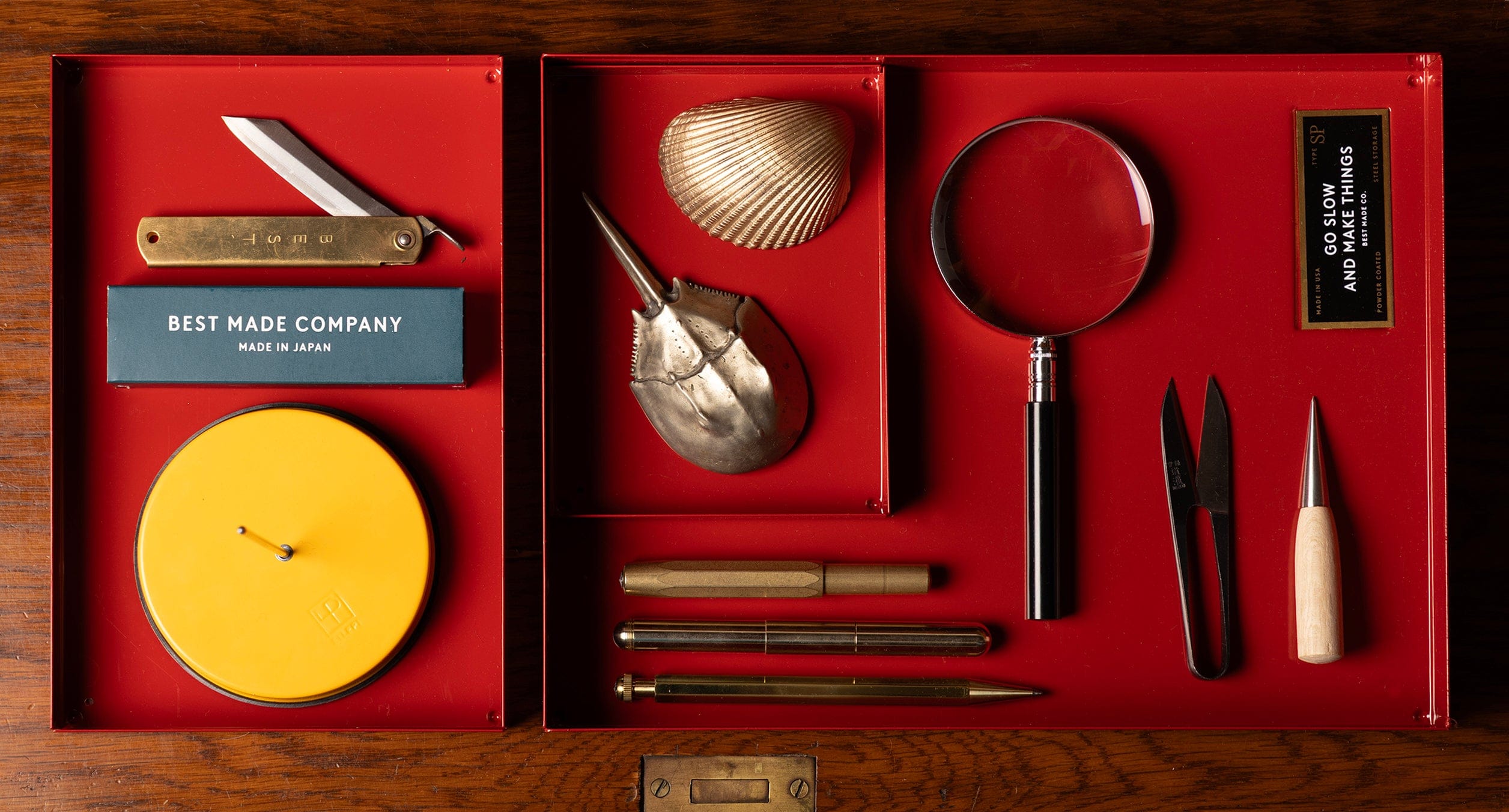 Collection of tools and items in a red box with 'Best Made Company' branding.