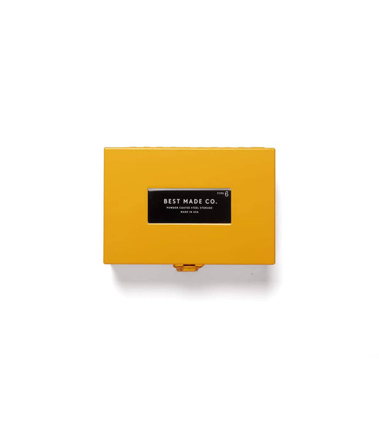 A Best Made Co. Type 6 Strongbox Yellow, a durable rectangular steel storage box with a yellow powder-coated finish and a black label reading “Best Made Co. Type 6, Powder Coated Steel Storage, Made in USA,” is displayed against a plain white background.