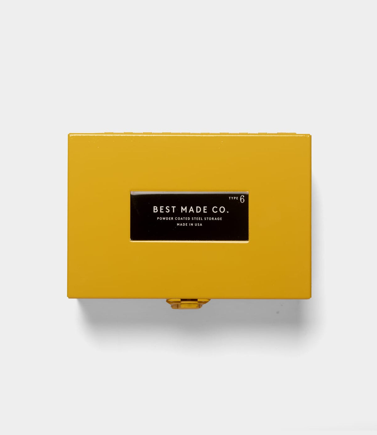 A Best Made Co. Type 6 Strongbox Yellow, a durable rectangular steel storage box with a yellow powder-coated finish and a black label reading “Best Made Co. Type 6, Powder Coated Steel Storage, Made in USA,” is displayed against a plain white background.