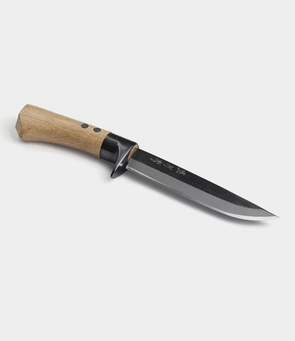 The Best Made Co. Hotta San Hunting Knife is a fixed-blade Japanese knife with a wooden handle, black guard, and Yasuki blue steel blade with engraved markings, shown on a plain white background.