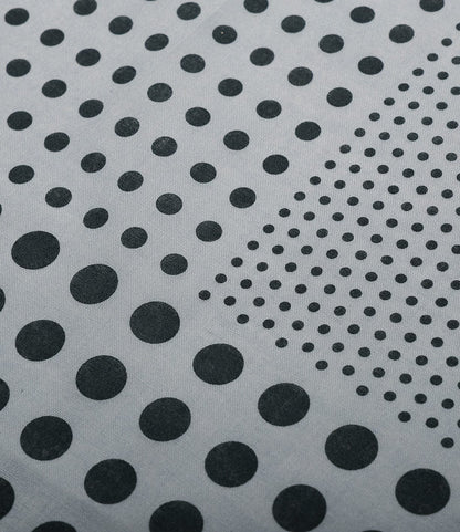 Close-up of the Trademark Bandana Blue by Best Made Co.—a gray surface features hand-printed black dots in varying sizes forming a gradient, reminiscent of traditional Japanese bandana motifs.
