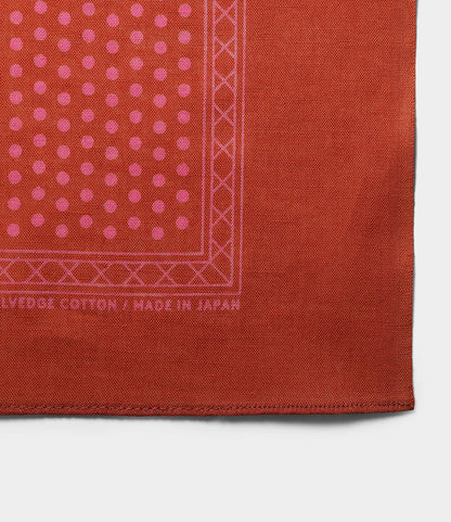 The Trademark Bandana Red by Best Made Co. is a Japanese bandana with a pink geometric border and polka dots, featuring “SELVEDGE COTTON • MADE IN JAPAN” on the edge and a neatly folded corner.