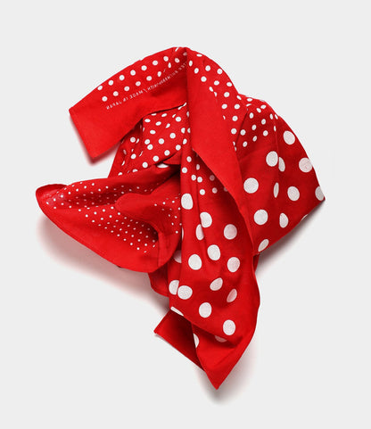 The Semaphore Bandana by Best Made Co. features red fabric with varied white polka dots, hand-printed in Japan and inspired by vintage shuttle looms, shown loosely crumpled on a plain light background.