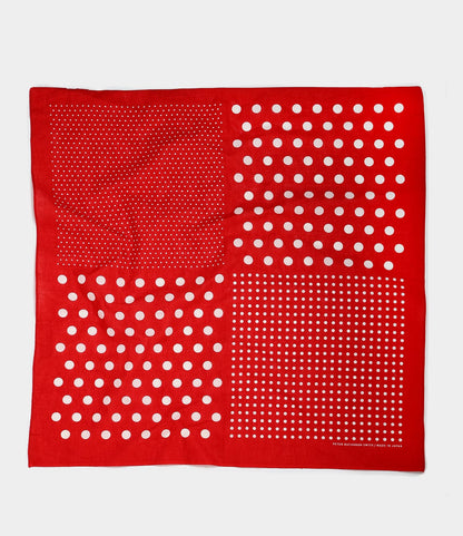 The Semaphore Bandana by Best Made Co. is a red square scarf, hand-printed in Japan, featuring four quadrants with distinct white dot patterns of varying sizes and spacing on a plain white background.