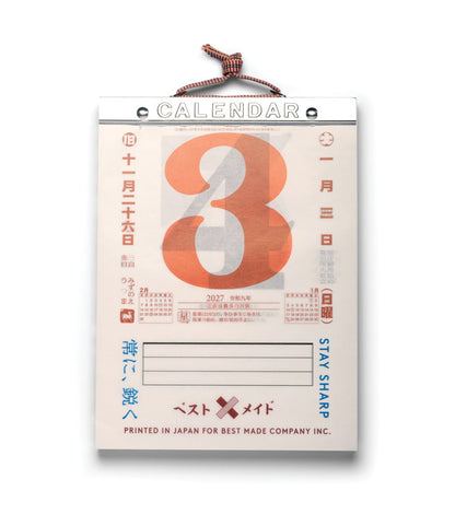 A hanging Best Made Co. Himekuri Calendar 2027 featuring a large orange number three, Japanese calendar text, and two small monthly grids for February and January.
