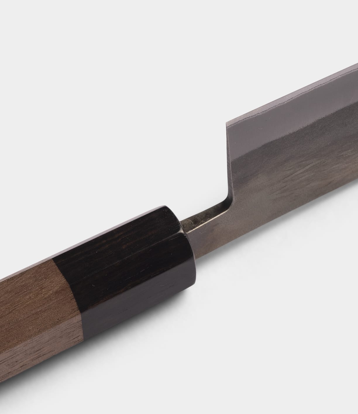Close-up of the Best Made Co. Aogami Gyuto Knife, showcasing its wooden handle and rectangular Blue Paper Steel No. 2 blade, set against a plain white background.