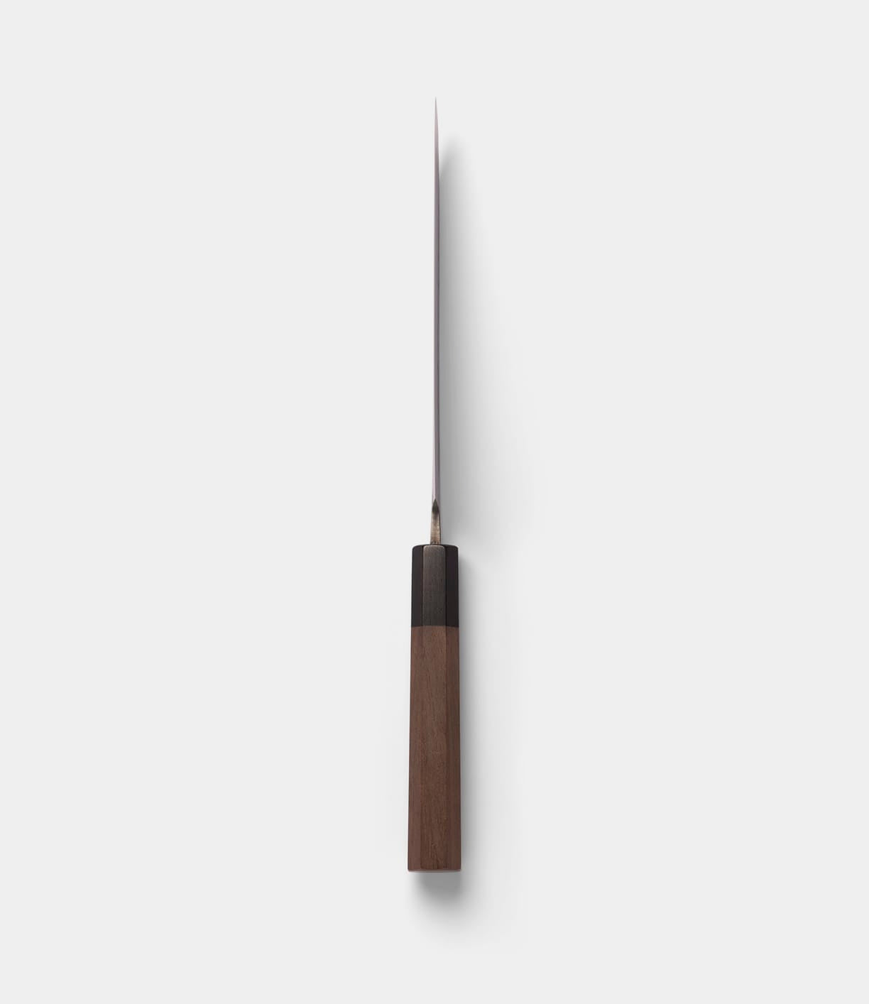 The Best Made Co. Aogami Santoku Knife, featuring a wooden handle and a sharp, straight Blue Paper Steel blade, is displayed from a top-down perspective against a plain white background.