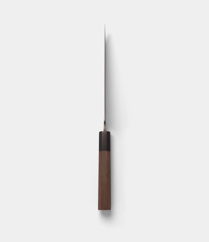 The Best Made Co. Aogami Santoku Knife, featuring a wooden handle and a sharp, straight Blue Paper Steel blade, is displayed from a top-down perspective against a plain white background.