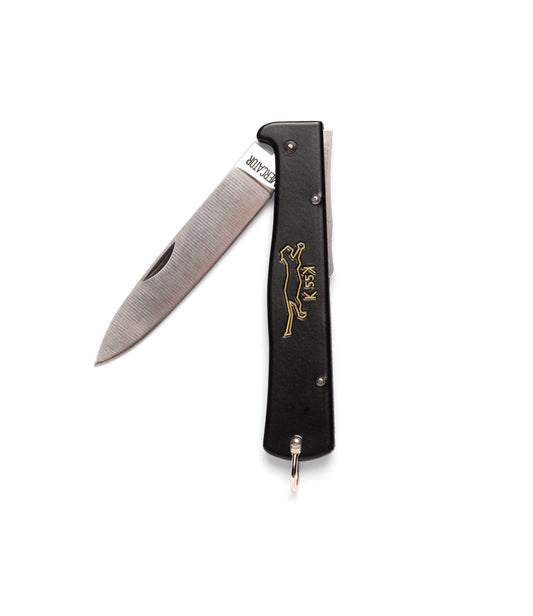 The Best Made Co. K55K Mercator is a black folding pocket knife with a partially open carbon steel blade and gold engraving of a leaping animal and 