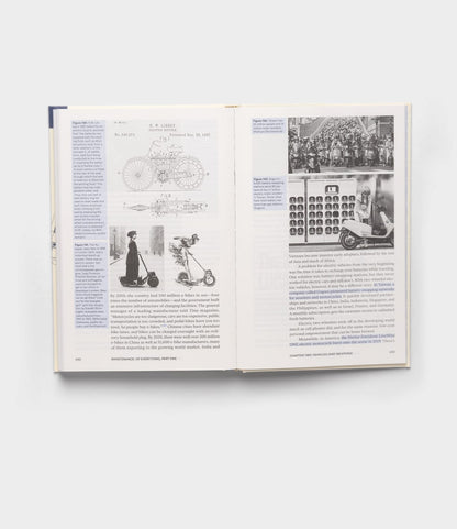An open copy of "Maintenance of Everything" by Best Made Co. displays pages with text and black-and-white images, such as bicycle diagrams, a woman on an early scooter, vintage vehicles, and a group of fixers in front of a stage.