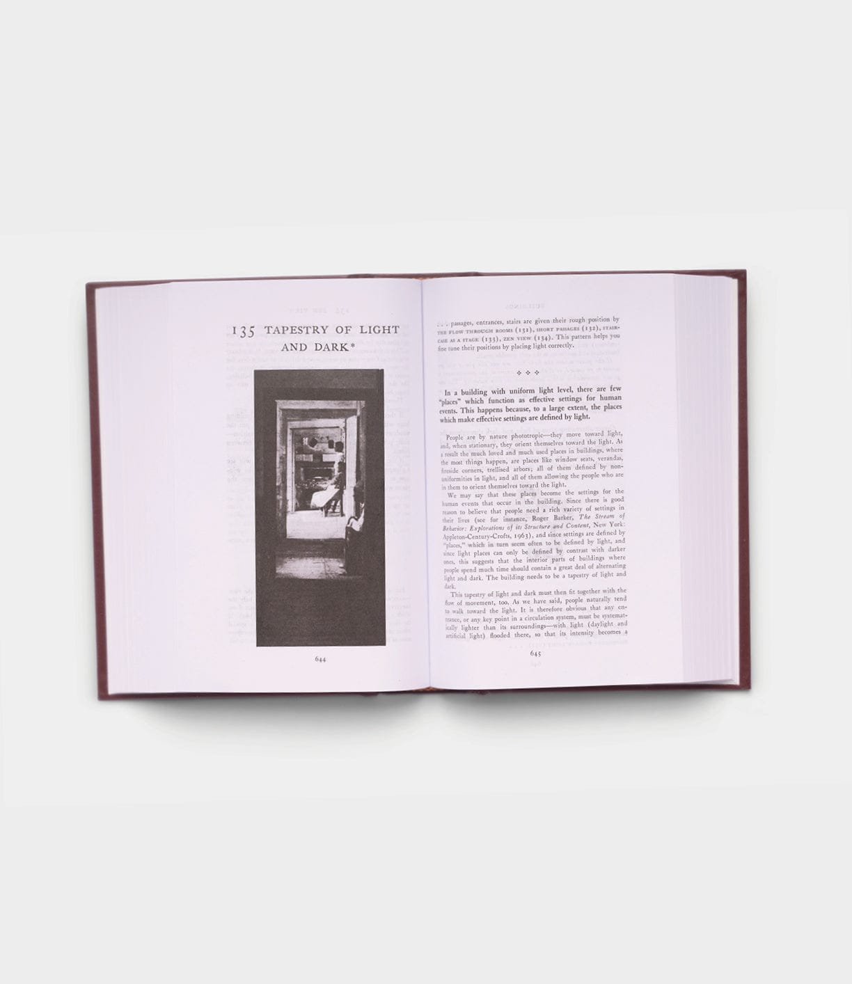 An open copy of Best Made Co.'s "A Pattern Language" displays the chapter "Tapestry of Light and Dark," featuring a black-and-white photo of doorways and a chair on the left page, with text filling both pages.