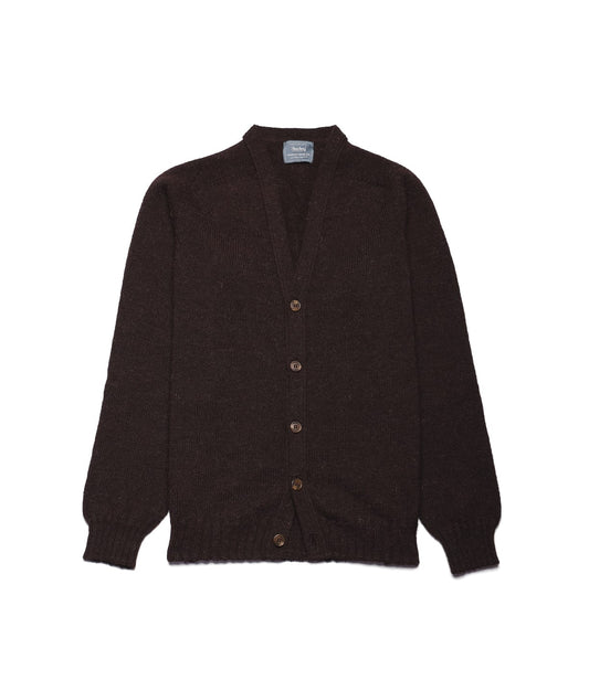 Best Made Co. Black Sheep Cardigan: a dark brown long-sleeved V-neck cardigan made of undyed Shetland wool, featuring five buttons down the front.