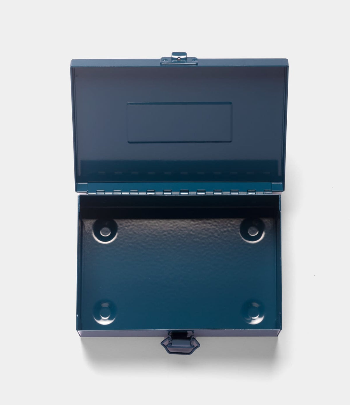 The Type 6 Strongbox Blue by Best Made Co. is shown open, displaying its empty interior with four round indents on the bottom, set against a plain white background.