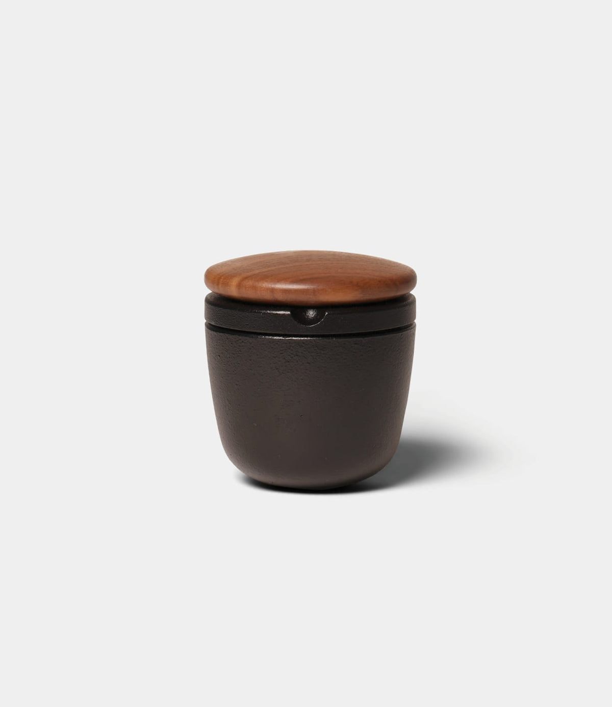Best Made Co. Cast Iron Grinder, a small, dark cast iron spice mill with a round walnut lid.