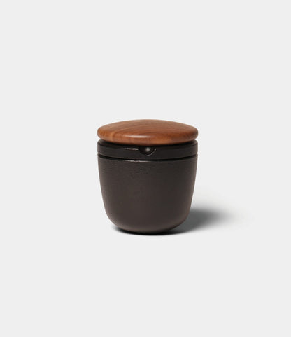 Best Made Co. Cast Iron Grinder, a small, dark cast iron spice mill with a round walnut lid.