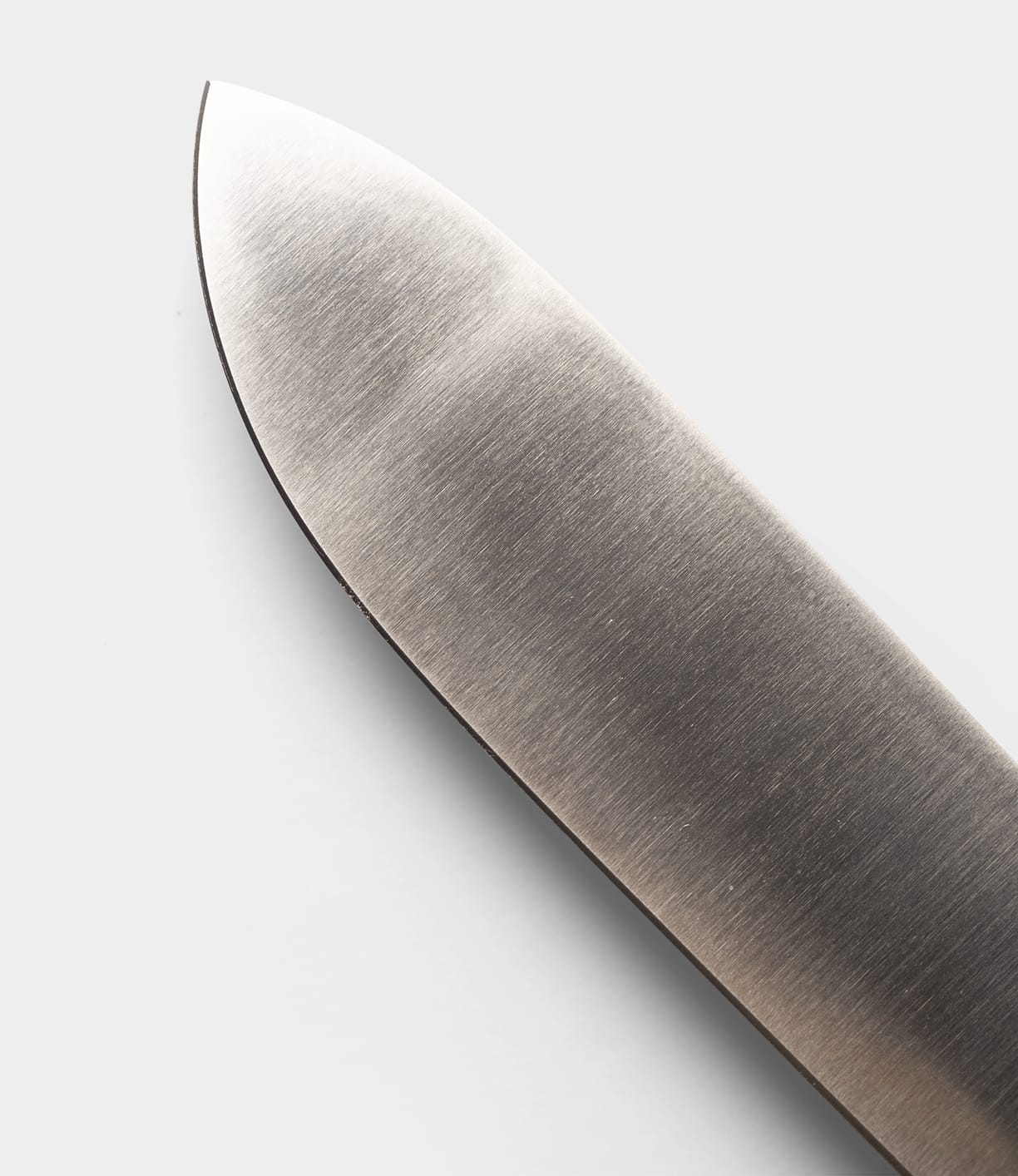 Close-up of the Sailor’s Knife blade from Best Made Co., featuring a sharp edge crafted from premium Niolox stainless steel, photographed against a plain white background.