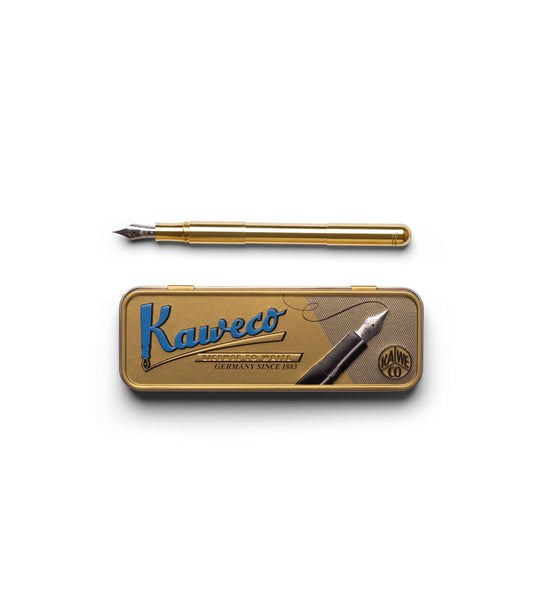 A Best Made Co. Kaweco Supra Fountain Pen and its cap rest inside a wooden drawer lined with yellow and white striped paper, partially open within a wooden cabinet.
