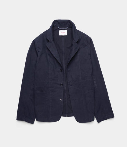 The Best Made Co. Possibilities Jacket Navy, a lightweight outerwear piece with a notched collar, three front buttons, and two front pockets, is displayed flat on a light gray background.