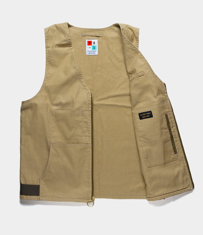 Best Made Co.'s PB-S’s Utility Vest Tan, crafted from Japanese cord fabric, features front pockets, a zipper closure, Cordura webbing loops for added utility, and a visible label. Vest shown flat with one side open to display the interior.