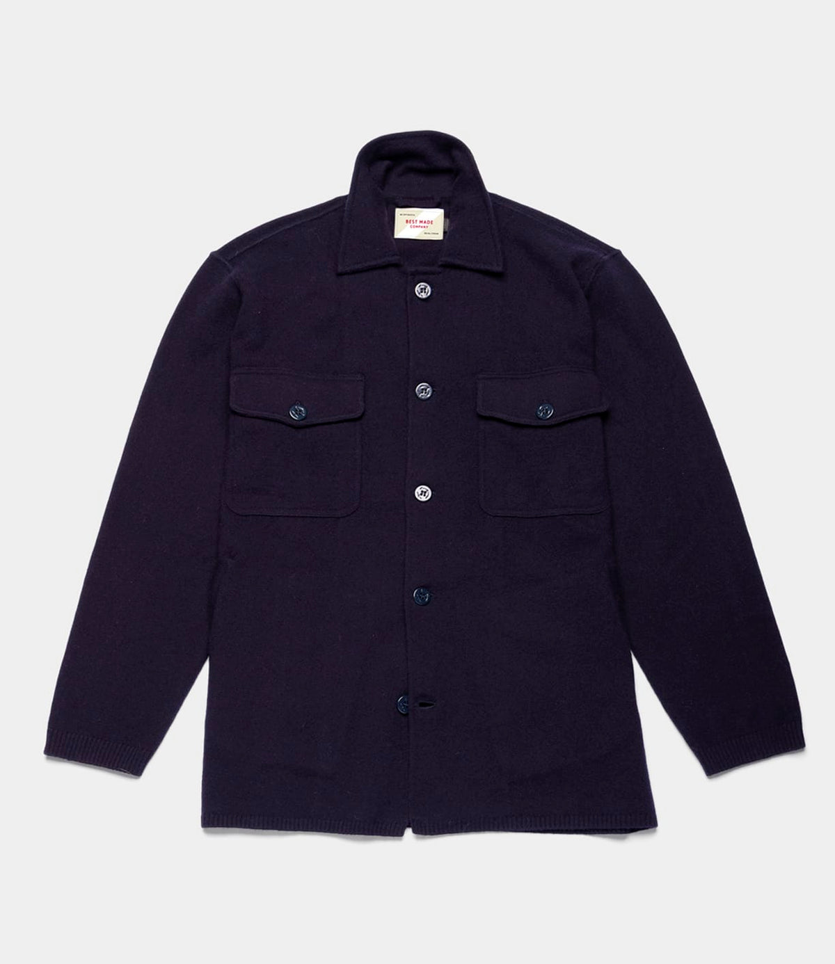 Navy blue Knit Lambswool CPO shirt with long sleeves, a collar, and two chest pockets.