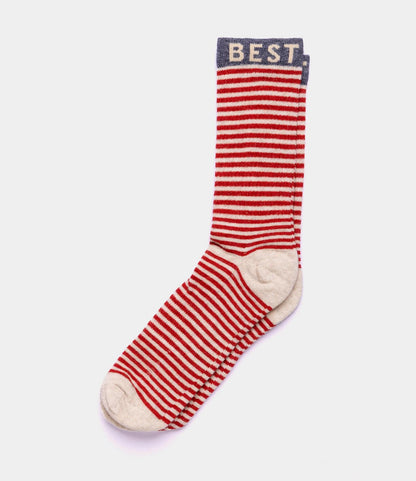 The Best Made Co. Standard Wool Socks feature red and white stripes, beige toe and heel accents, a blue cuff with "BEST," and merino wool for moisture wicking and year-round comfort.